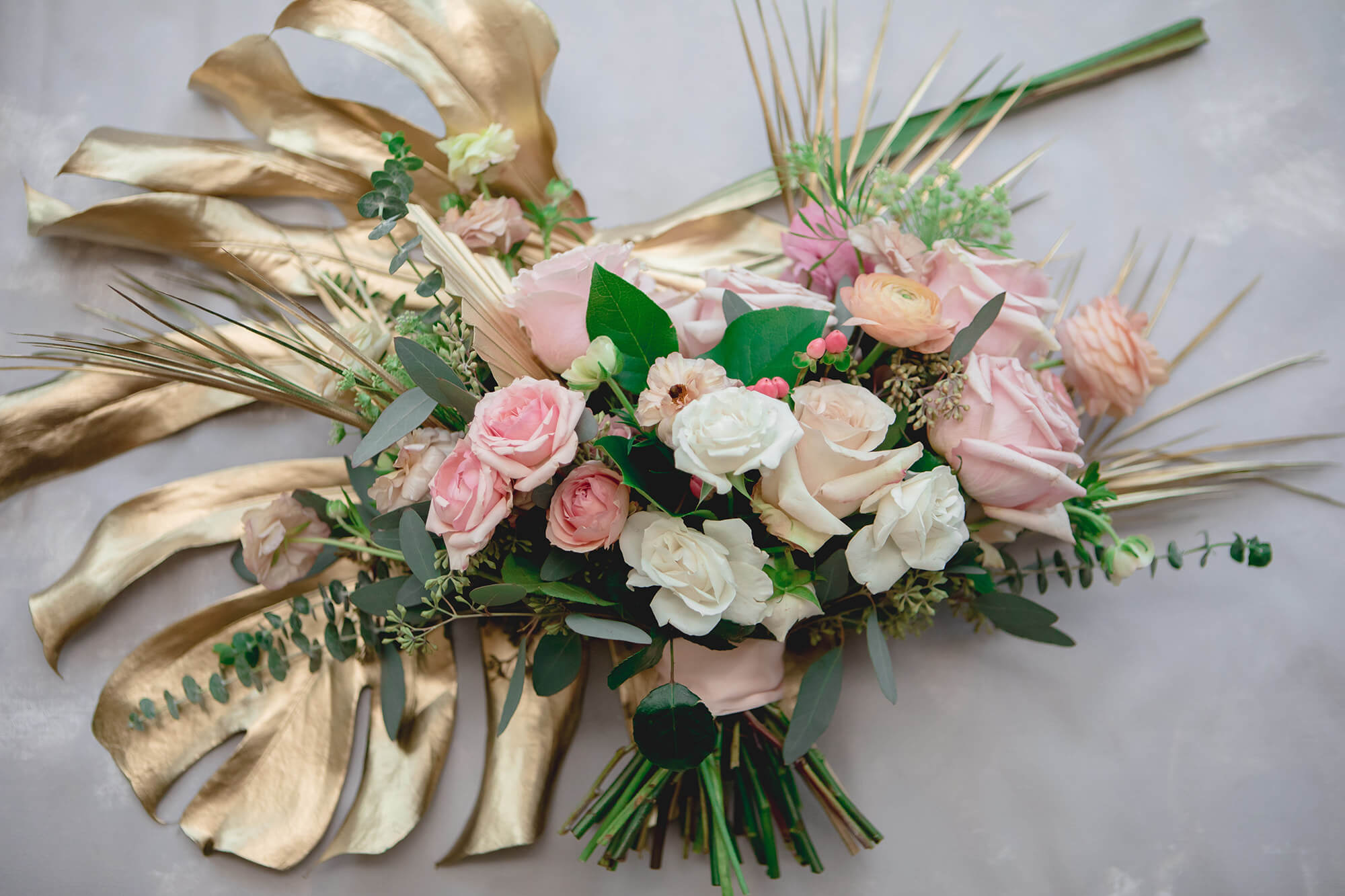 Soft pink and gold bouquet flat lay